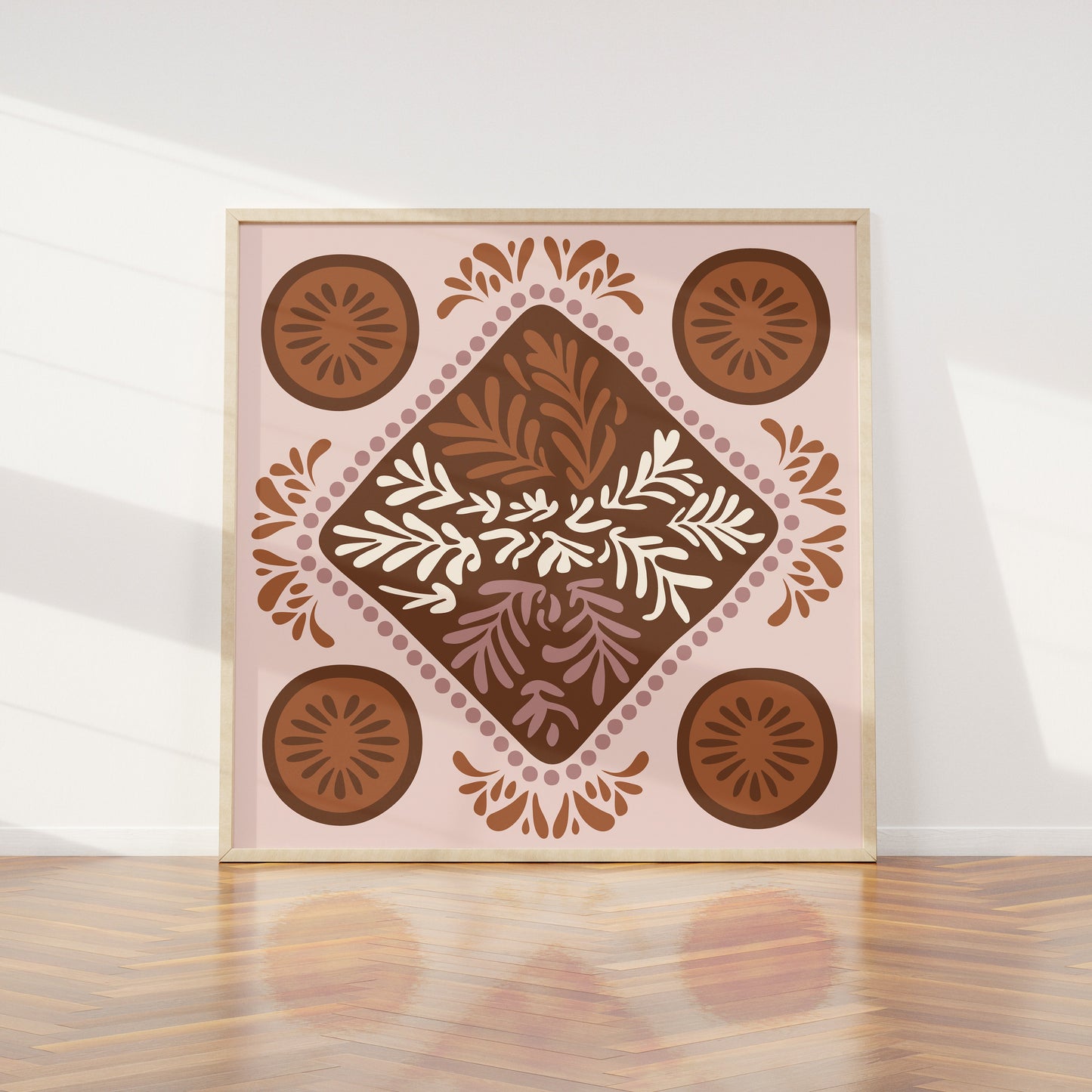 Decorative wall art with a geometric pattern on a white wall.