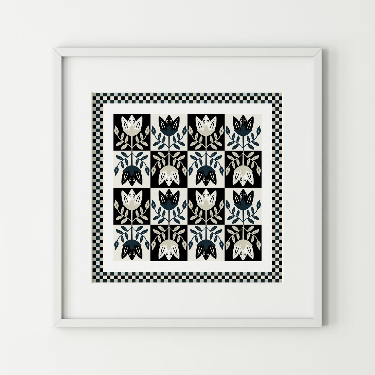 Framed black and white patterned artwork on a light gray background