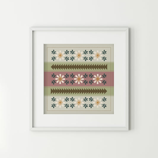 Framed patterned artwork on a white wall